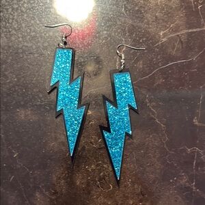 Blue glitter lightning bolt earrings approximately 3”